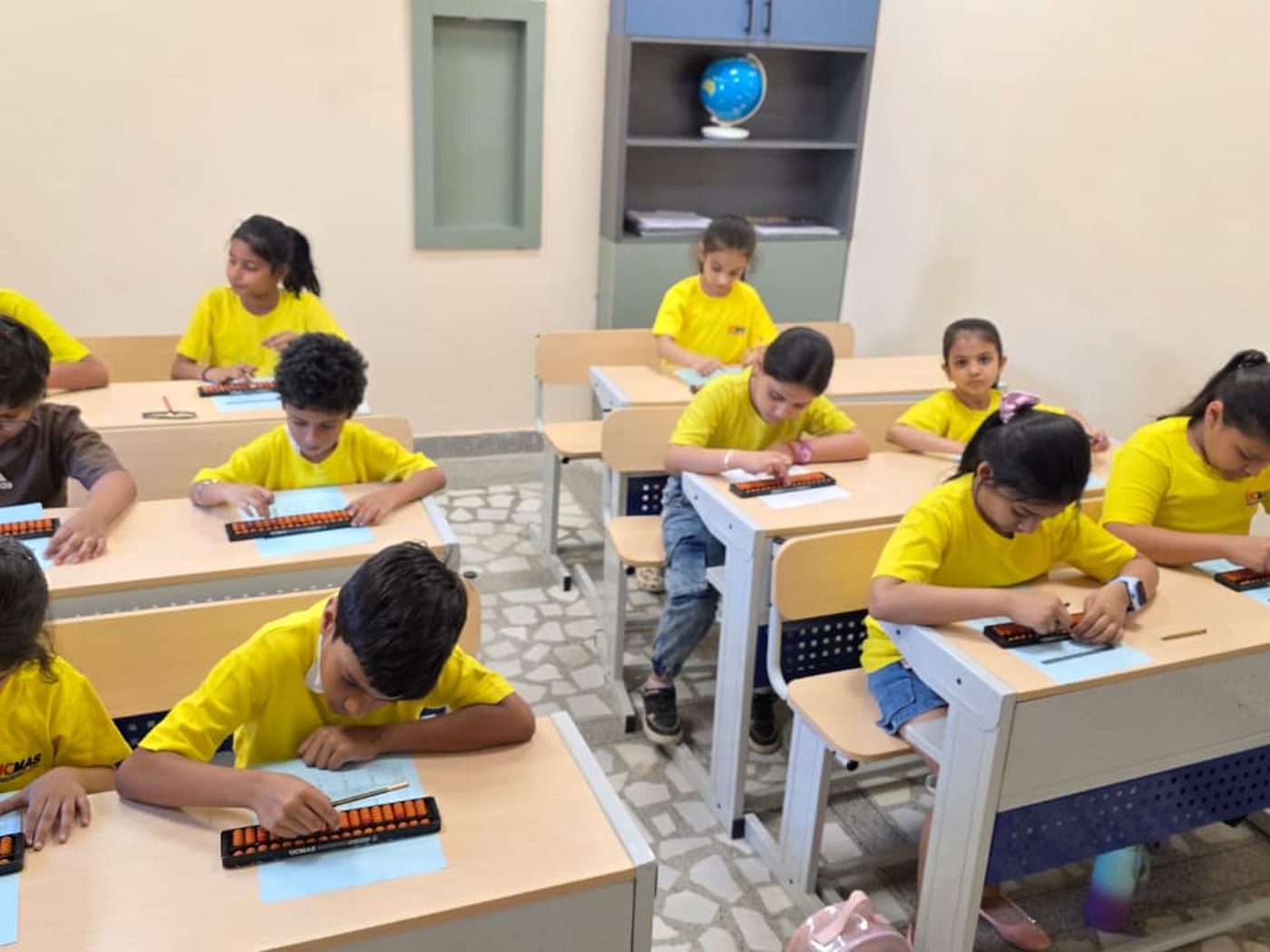 Children working with abacuses in a UCMAS class in Uttar Pradesh