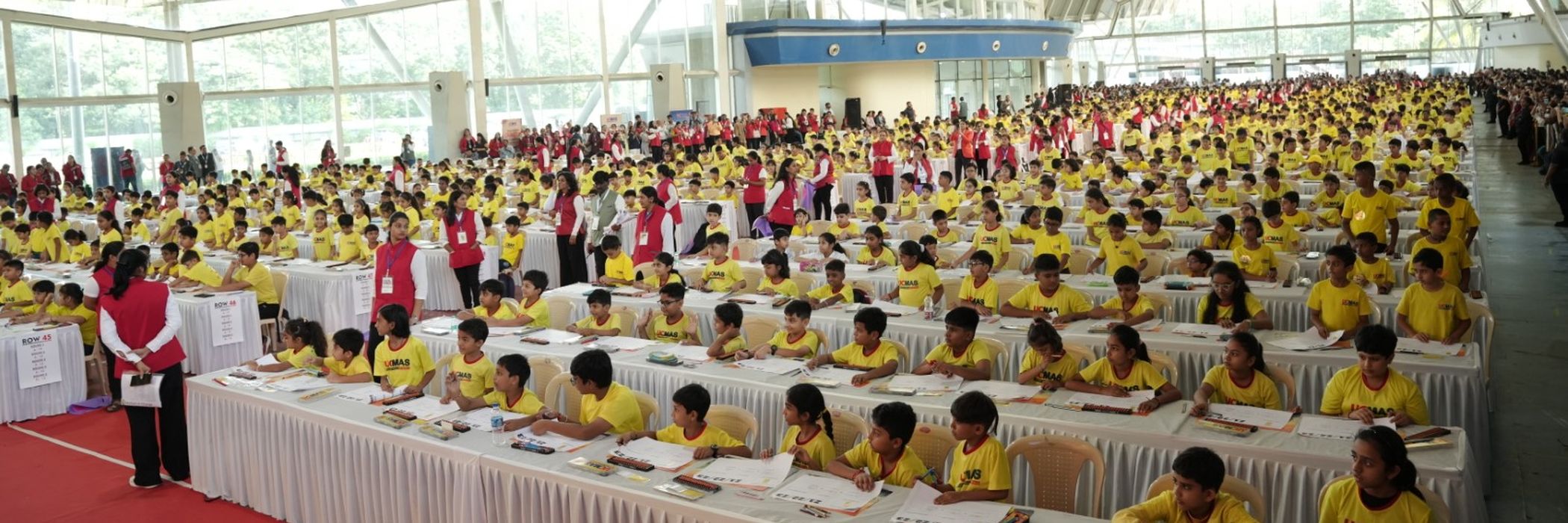 Thousands of UCMAS students seated in rows at a national-level abacus competition